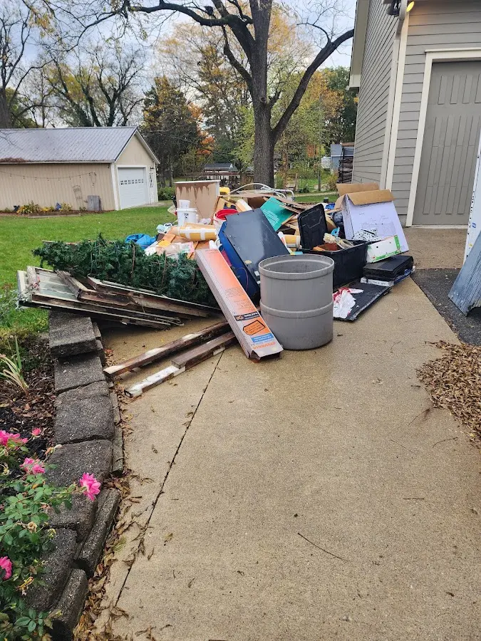 Dumpster being loaded with debris for Commercial Dumpster Rental in Middleburg Heights